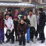 students having fun in the snow on a ski trip